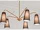 Modern dining room chandelier with black fabric lampshades and gold hardware at 3932 Boston Common St, Suwanee, GA 30024