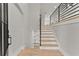 Inviting entryway featuring wood flooring, staircase, and modern design elements at 3932 Boston Common St, Suwanee, GA 30024