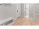 Hallway featuring light hardwood floors and bathroom view at 3932 Boston Common St, Suwanee, GA 30024