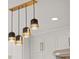 Modern kitchen lighting fixture with gold accents over white cabinets at 3932 Boston Common St, Suwanee, GA 30024