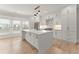 Modern kitchen with white cabinets, quartz countertops, and stainless steel appliances at 3932 Boston Common St, Suwanee, GA 30024