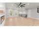 Bright living room featuring a modern fireplace, and staircase at 3932 Boston Common St, Suwanee, GA 30024