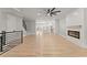 Spacious living room with a fireplace, hardwood floors, and modern finishes at 3932 Boston Common St, Suwanee, GA 30024