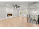 Spacious living room with a fireplace, large windows and neutral tones at 3932 Boston Common St, Suwanee, GA 30024