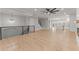 Open-concept living space with light wood floors, neutral walls, and staircase at 3932 Boston Common St, Suwanee, GA 30024