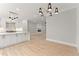 Open concept living space with kitchen and gas fireplace at 3932 Boston Common St, Suwanee, GA 30024