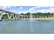 Scenic pond view with unique bridge design and central fountain feature at 3932 Boston Common St, Suwanee, GA 30024
