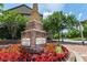Shadowbrook at Town Center signage surrounded by colorful flowers and greenery at 3932 Boston Common St, Suwanee, GA 30024
