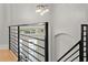 Modern staircase with black metal railings and globe pendant lighting at 3932 Boston Common St, Suwanee, GA 30024