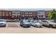 Street view of local businesses with on street parking in front of building at 3932 Boston Common St, Suwanee, GA 30024