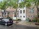 Charming townhome exterior with a manicured lawn and front yard in a desirable neighborhood at 3932 Boston Common St, Suwanee, GA 30024