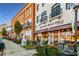 Street view of local businesses and townhomes in walkable community at 3932 Boston Common St, Suwanee, GA 30024