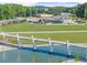 Picturesque walking bridge crossing a serene pond, connecting various park areas and offering scenic views at 3932 Boston Common St, Suwanee, GA 30024