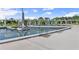 Modern sculpture and water feature within green recreational area with walking bridge at 3932 Boston Common St, Suwanee, GA 30024