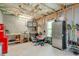 Unfinished basement area with shelving, a workbench, storage, and lawn care tools at 412 Nickajack Retreat Ln, Smyrna, GA 30082