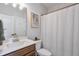 Cozy bathroom with modern vanity, white shower curtain, and a neutral color scheme for a fresh, clean look at 412 Nickajack Retreat Ln, Smyrna, GA 30082