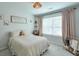 Bedroom with natural light, neutral carpet and walls, featuring chevron quilt and safari decor at 412 Nickajack Retreat Ln, Smyrna, GA 30082