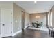 Elegant dining room with wainscoting detail, modern lighting, and ample natural light at 412 Nickajack Retreat Ln, Smyrna, GA 30082