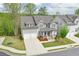 Charming two-story home featuring a well-maintained lawn, and a two-car garage at 412 Nickajack Retreat Ln, Smyrna, GA 30082