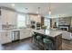 Modern kitchen with stainless steel appliances, granite countertops, and island seating at 412 Nickajack Retreat Ln, Smyrna, GA 30082