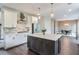 Modern kitchen featuring white cabinetry, a central island, and stainless steel appliances with a view to dining at 412 Nickajack Retreat Ln, Smyrna, GA 30082