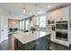 Bright, open kitchen with a large island, stainless steel appliances, and pendant lighting at 412 Nickajack Retreat Ln, Smyrna, GA 30082