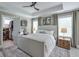 Serene main bedroom with walk-in closet, ceiling fan, and neutral tones at 412 Nickajack Retreat Ln, Smyrna, GA 30082