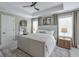 Serene main bedroom featuring a ceiling fan, neutral tones, and ample natural light at 412 Nickajack Retreat Ln, Smyrna, GA 30082