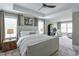 Spacious main bedroom featuring tray ceilings, ample windows, soft carpet, and a sitting area at 412 Nickajack Retreat Ln, Smyrna, GA 30082