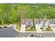 Aerial view of home with manicured lawn and landscaping, plus adjacent homes in community at 412 Nickajack Retreat Ln, Smyrna, GA 30082