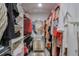 Walk-in closet with rods and shelves has ample storage space for hanging and folded clothes at 412 Nickajack Retreat Ln, Smyrna, GA 30082