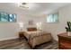 Bedroom with stylish decor featuring hardwood flooring, a ceiling fan, and natural light at 880 Glendale Ne Ter # 9, Atlanta, GA 30308