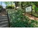 Landscaped hillside leading to the complex sign at 880 Glendale Ne Ter # 9, Atlanta, GA 30308