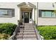 Elegant entryway with a black front door, columns, and stairs leading to the entrance at 880 Glendale Ne Ter # 9, Atlanta, GA 30308