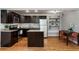 Well-lit kitchen featuring stainless steel appliances, granite countertops, and an adjacent dining area at 880 Glendale Ne Ter # 9, Atlanta, GA 30308