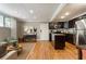 Open-concept living space with hardwood floors seamlessly flowing into the modern kitchen at 880 Glendale Ne Ter # 9, Atlanta, GA 30308