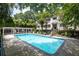 Community pool with a pergola and many lounge chairs at 880 Glendale Ne Ter # 9, Atlanta, GA 30308