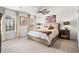 Cozy bedroom with a ceiling fan, neutral tones, and large windows offering natural light at 1 James River Ne Pl, Atlanta, GA 30342