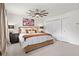 Bedroom showcasing a ceiling fan, art pieces, and white closets adding a modern look at 1 James River Ne Pl, Atlanta, GA 30342