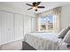 Bedroom with a large window and triple closets for ample storage and natural light and neutral tones at 1 James River Ne Pl, Atlanta, GA 30342