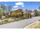 Rosewood Plantation entrance with manicured landscaping and stately brick gatehouse at 1 James River Ne Pl, Atlanta, GA 30342