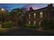 Charming two-story brick townhome featuring black shutters at twilight at 1 James River Ne Pl, Atlanta, GA 30342