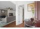 Inviting foyer with hardwood floors that leads into a living room with fireplace at 1 James River Ne Pl, Atlanta, GA 30342