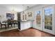 Bright and open kitchen with a breakfast bar and French door access to a brick-walled private patio at 1 James River Ne Pl, Atlanta, GA 30342