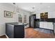 An updated kitchen with stainless steel appliances, granite counters, and a view to the patio at 1 James River Ne Pl, Atlanta, GA 30342