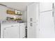 A functional laundry room featuring modern washer and dryer, along with ample storage space at 1 James River Ne Pl, Atlanta, GA 30342