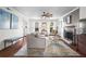 Bright living room featuring fireplace, hardwood floors, and a view of the outdoors at 1 James River Ne Pl, Atlanta, GA 30342