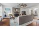 Comfortable living room featuring hardwood floors, fireplace, and ample natural light at 1 James River Ne Pl, Atlanta, GA 30342