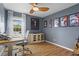 Office space with wood floors, a desk, and large windows providing abundant natural light at 1 James River Ne Pl, Atlanta, GA 30342