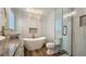 Contemporary bathroom featuring a soaking tub, glass shower, and vessel sinks at 1200 Izod Ct, Lawrenceville, GA 30044